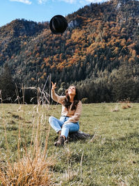 Young couple sitting on field