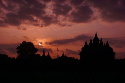 Silhouette of temple against sky during sunset