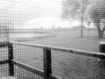 Fence seen through window