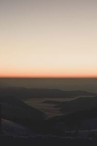 Scenic view of landscape against clear sky during sunset