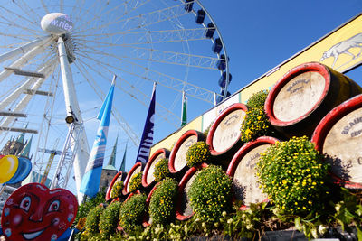 Low angle view of ferris wheel against sky