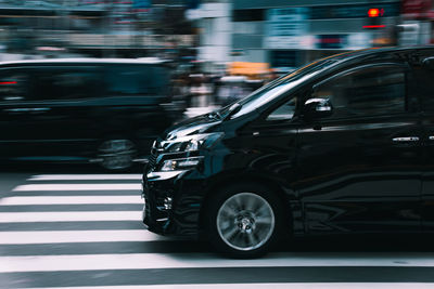 Blurred motion of car on street in city