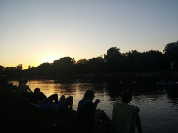 Scenic view of lake at sunset