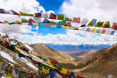 Bunting flags hanging over mountains during winter