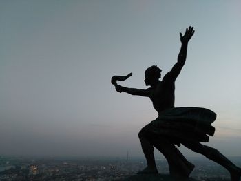 Silhouette of statue against clear sky