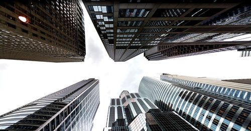 Low angle view of buildings against sky in city