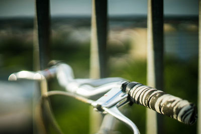 Close-up of bicycle on railing