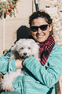 Portrait of dog wearing sunglasses at home