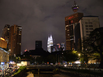 Illuminated buildings in city at night