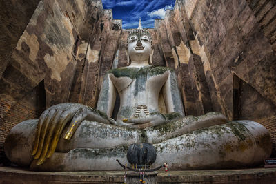 Low angle view of statue against building