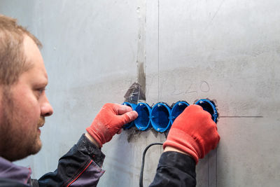 A set of plastic inserts for red and blue sockets. construction vacuum cleaner