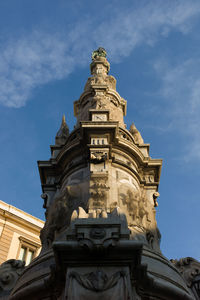 Low angle view of obelisco dell immacolata against sky