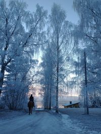 Full length of woman on snow covered land during winter