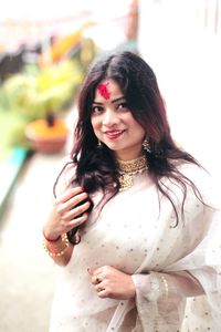 Portrait of smiling woman in sari