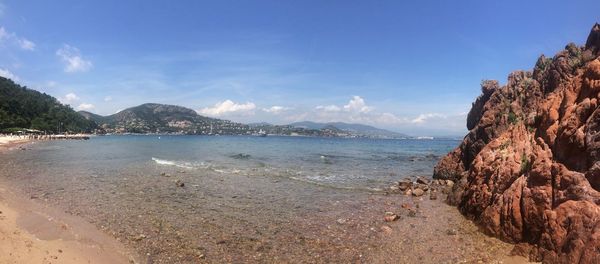 Scenic view of sea against blue sky