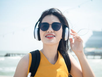 Portrait of young woman wearing sunglasses