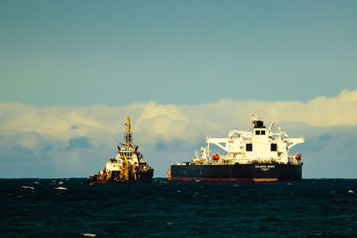 View of ship in sea against sky