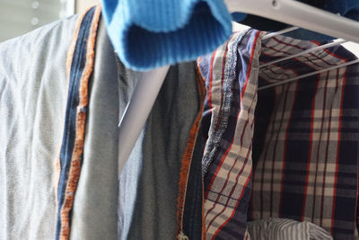 Close-up of clothes hanging on rack