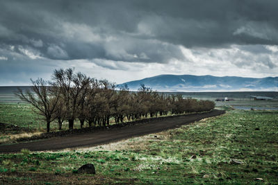 Scenic view of mountains against cloudy sky