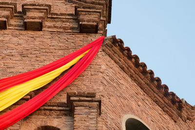 Low angle view of building with spain flag