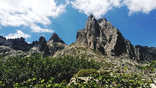 Low angle view of rocks against sky