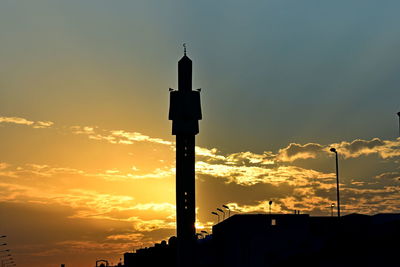 Low angle view of silhouette street light against sky during sunset