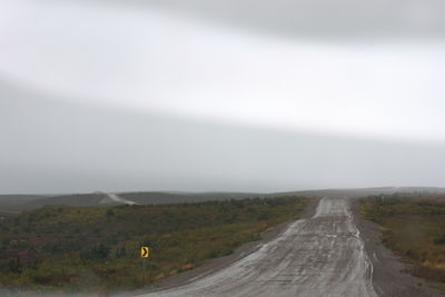 Road amidst landscape against sky