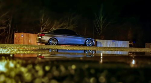 Close-up of toy car in city at night