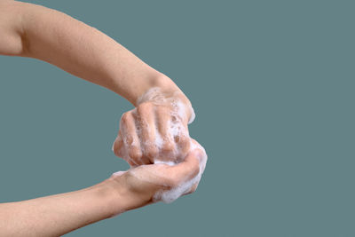 Hygiene concept. woman washing hands with soap