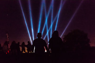 Silhouette people at music concert