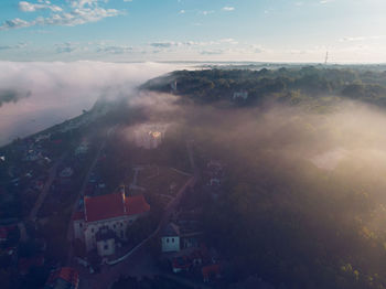 Aerial view of city and buildings against sky