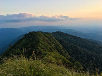 Scenic view of mountains against sky during sunset