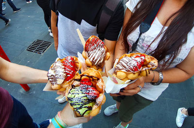 High angle view of people holding ice cream