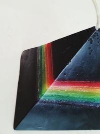 Close-up of multi colored pencils against white background