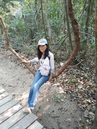 Portrait of young woman in forest