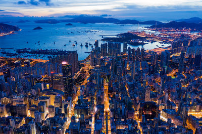 High angle view of city lit up at dusk