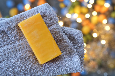 Close-up of bar soap with towel