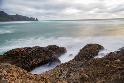 Scenic view of sea against cloudy sky