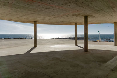 Scenic view of sea against sky seen through window