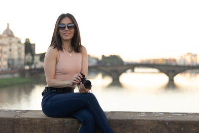 Portrait of photographer woman unfocused background at florence, italy. 50mm lens