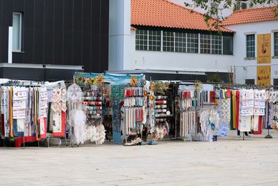 Market  on street amidst buildings in city