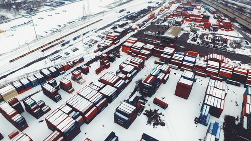 High angle view of snow covered cargo containers on field