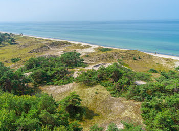 High angle view of sea shore against sky