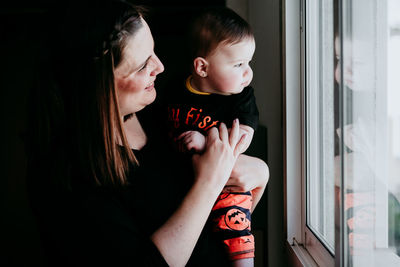 Portrait of mother and daughter at home