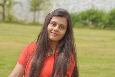 Portrait of young woman at park