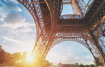 Low angle view of eiffel tower against sky during sunset