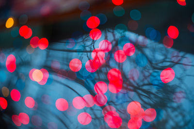 Full frame shot of illuminated red lights