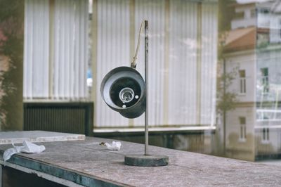 Close-up of electric lamp on table