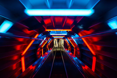 Blurred motion of illuminated subway station