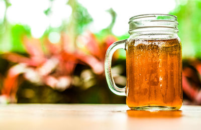 Close-up of drink in jar on table